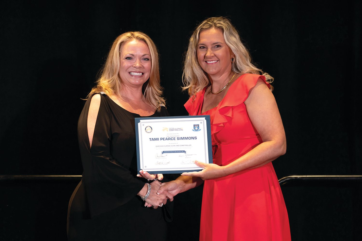 FCCC provided Tami Pearce Simmons (right) with a certificate signed by Manatee County Clerk of Court and Comptroller and 2021-2022 FCCC President Angelina “Angel” Colonneso, Esq. (left).